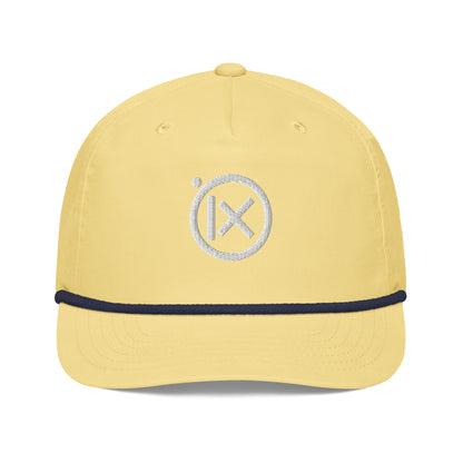 Yellow snapback cap front view with white circular X logo and navy trim.
