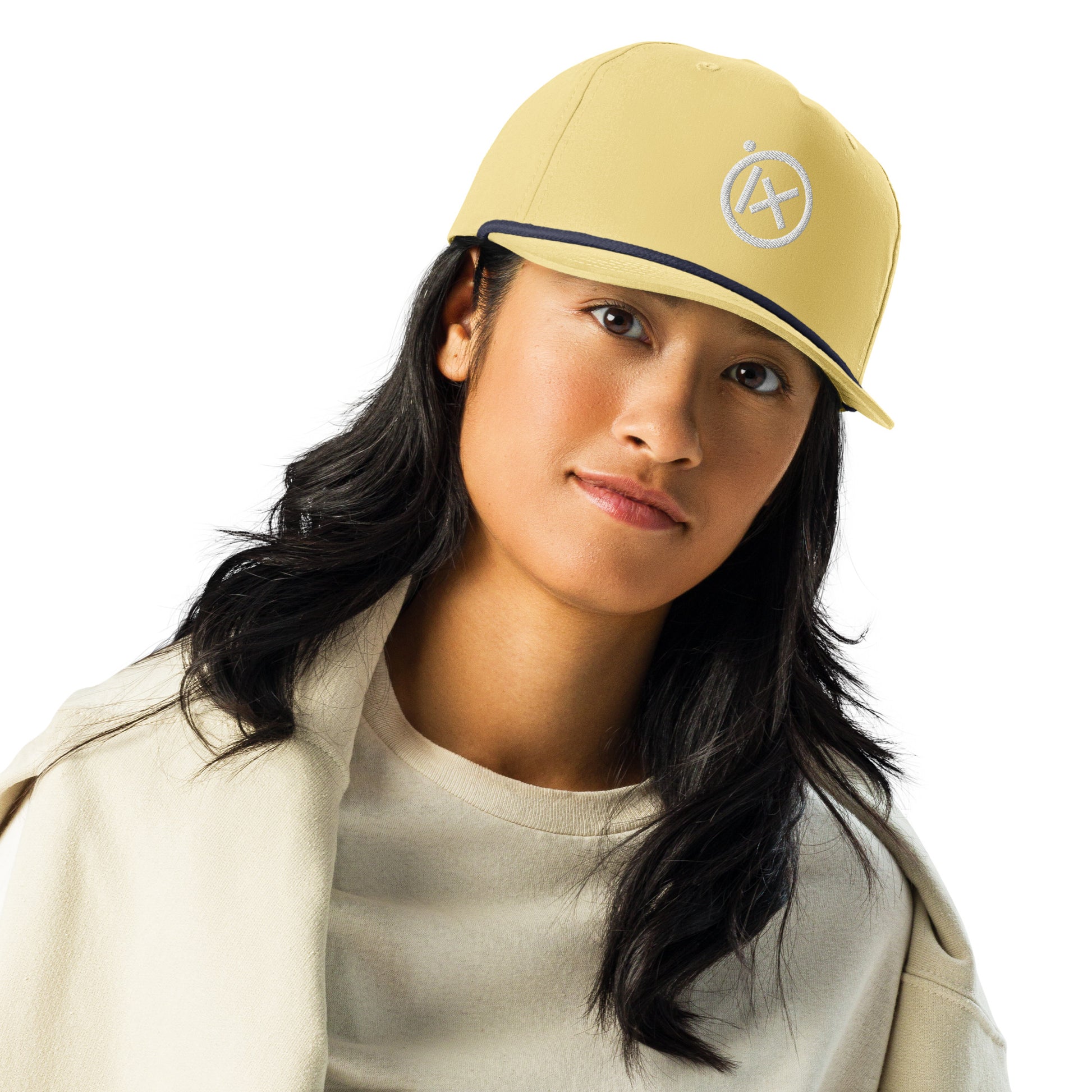 Yellow golf snapback cap with navy edge and white circular X logo on front.