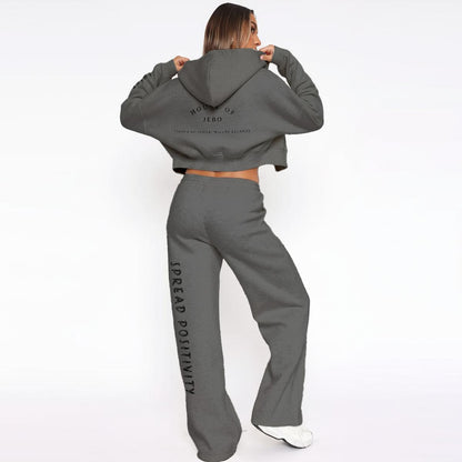 Women’s fleece tracksuit: dark gray cropped hoodie with hood and wide-leg pants.
