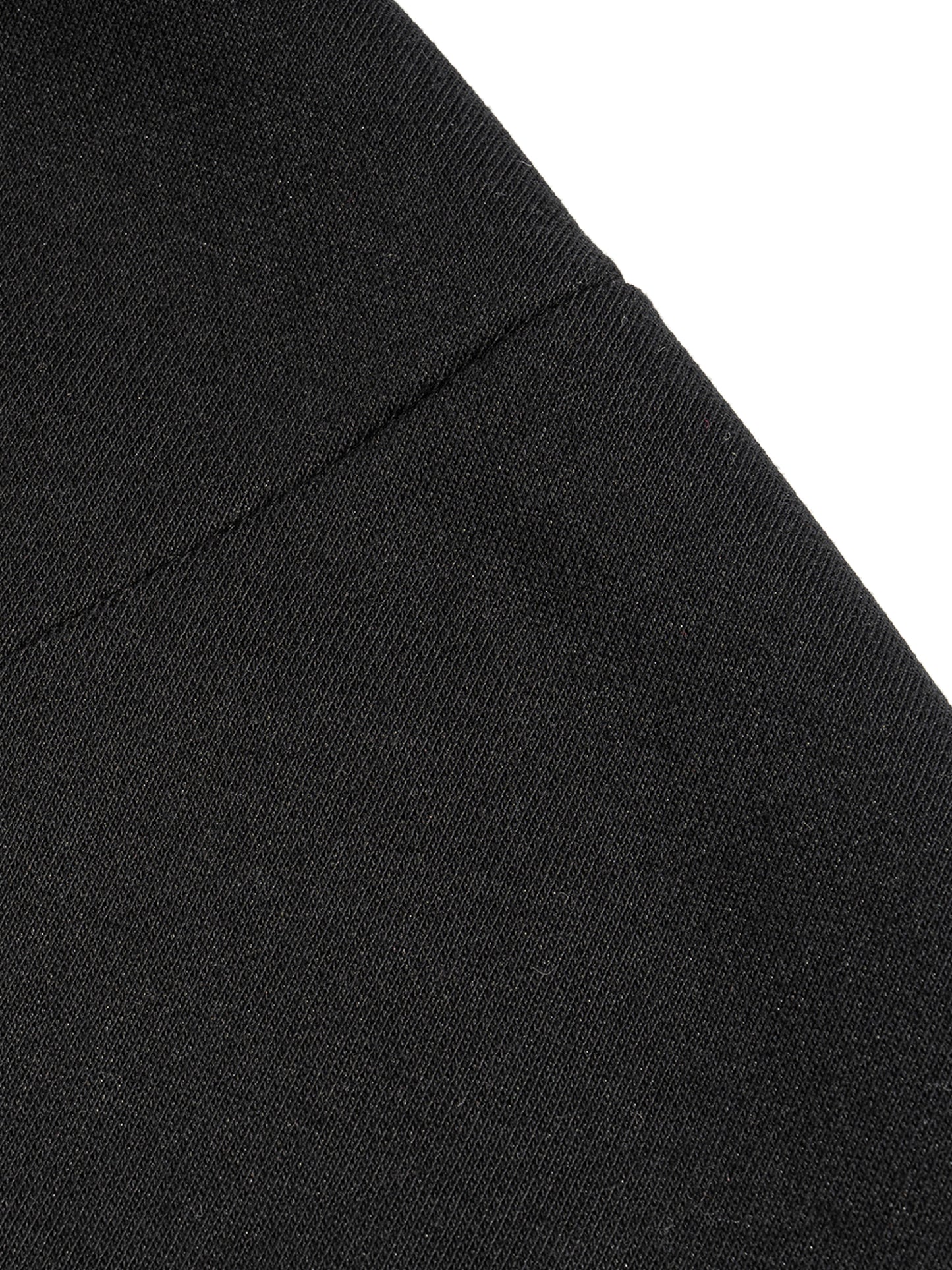 Black French terry fabric close-up with side seam detail