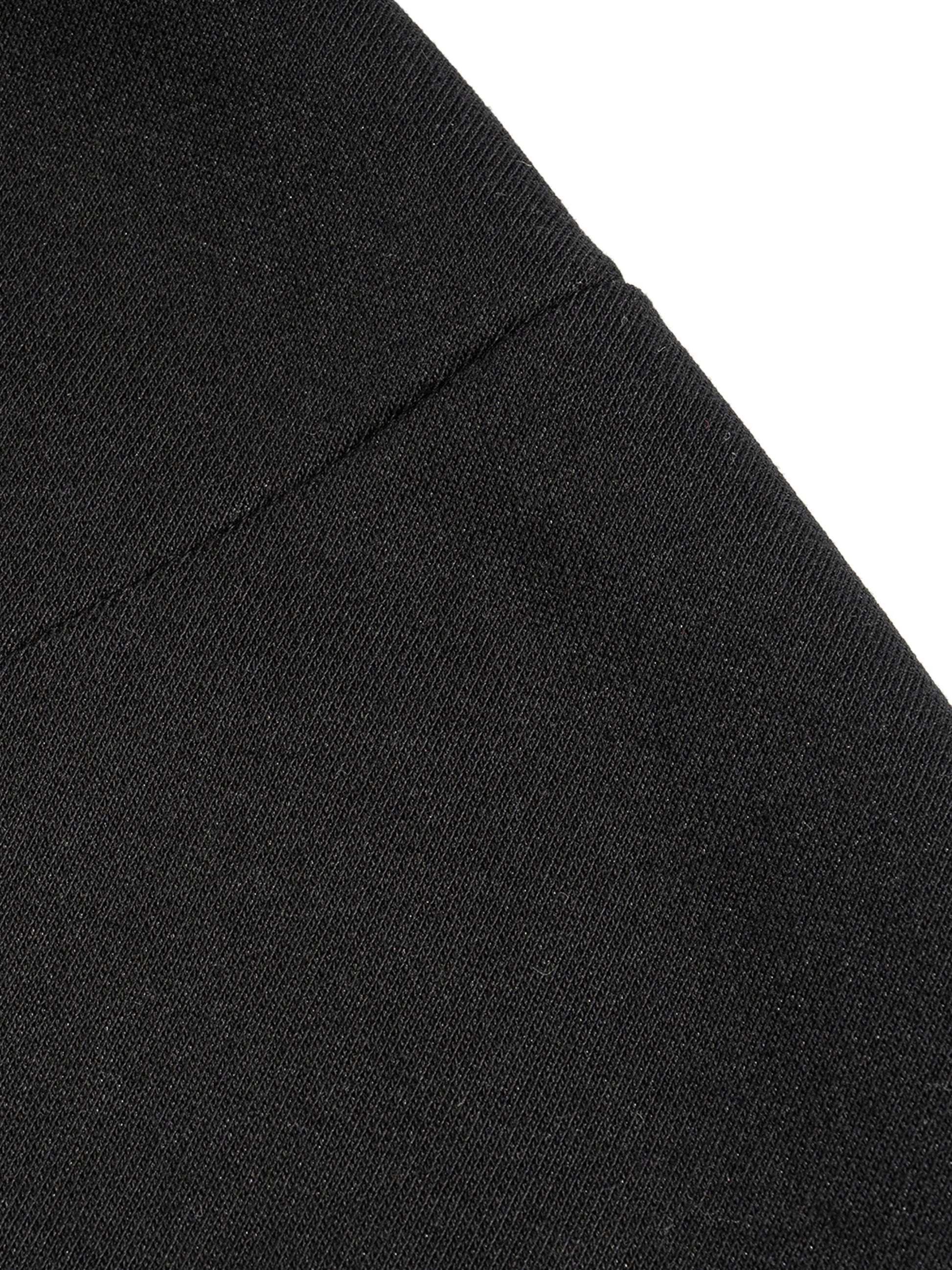 Black French terry fabric close-up with side seam detail