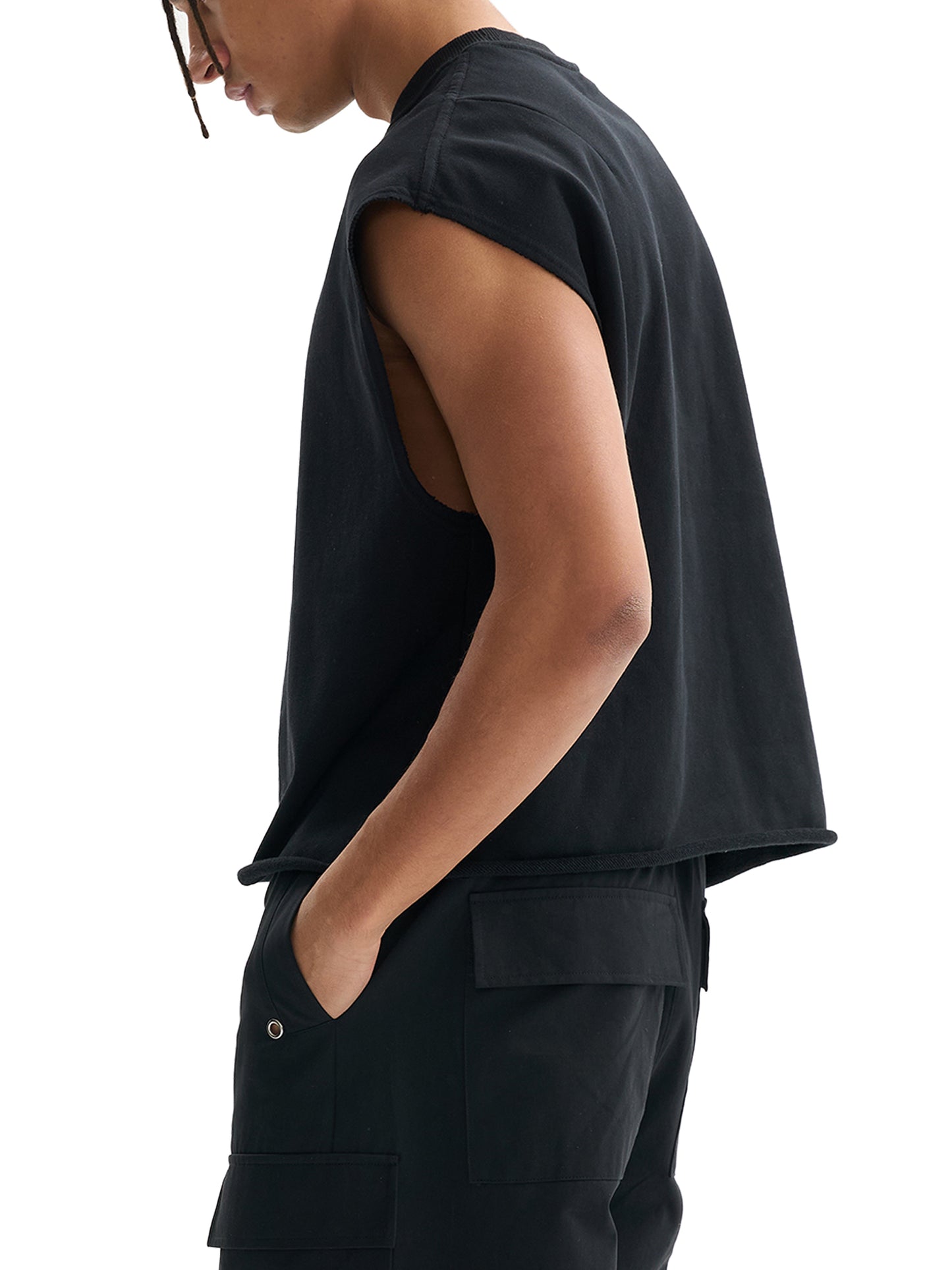Black boxy tank top on model, sleeveless side view with relaxed fit