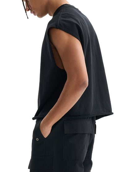 Black boxy tank top on model, sleeveless side view with relaxed fit