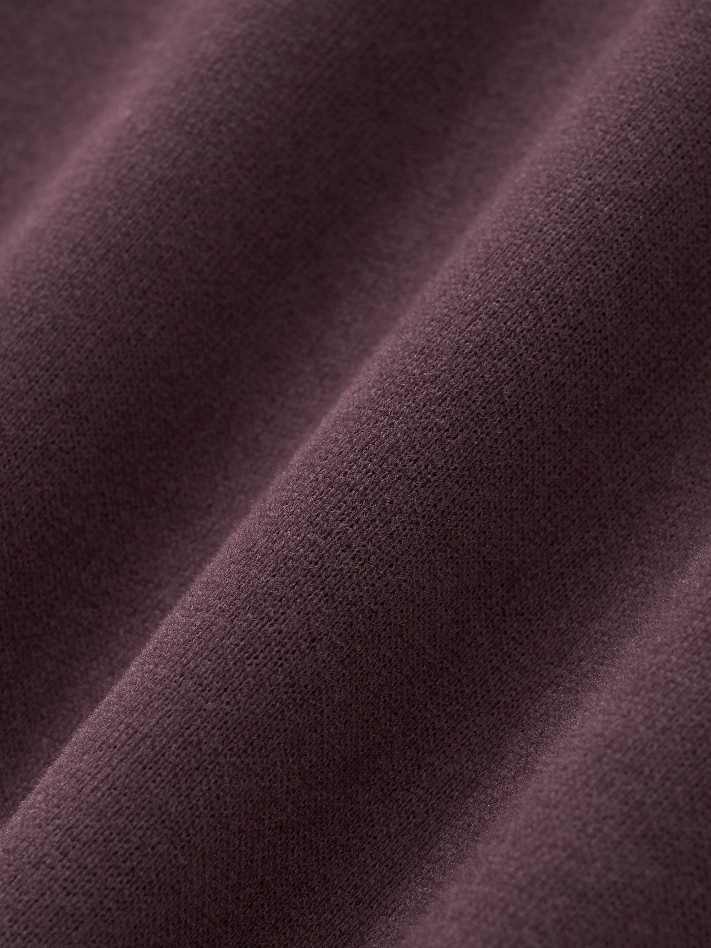 Women’s cropped hoodie fabric in dark reddish purple with fine knit texture