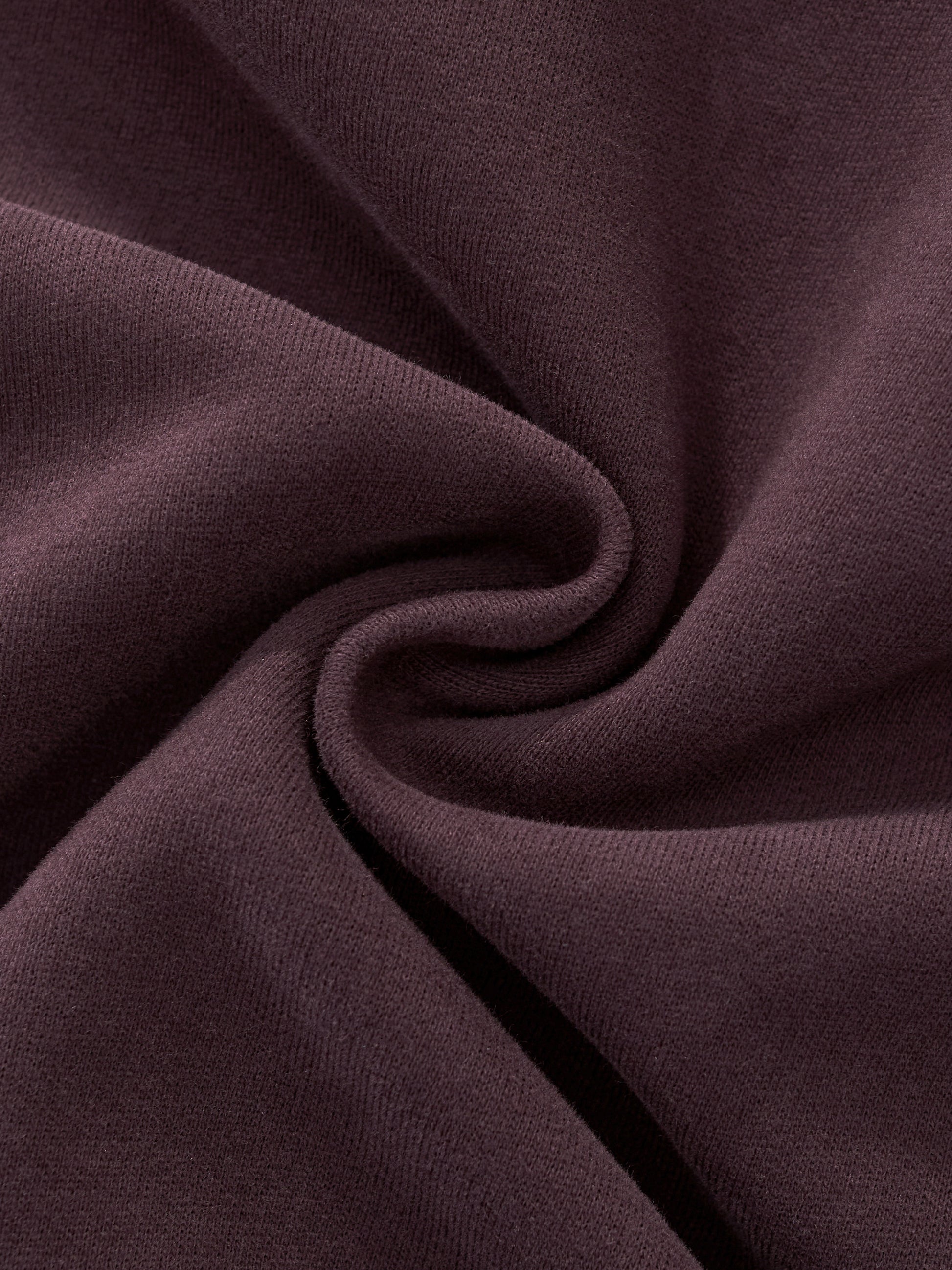 Women’s hoodie fabric detail in dark reddish purple with smooth seam fold