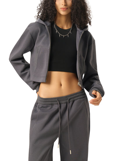 Women’s cropped zip-up hoodie in dark gray with adjustable hood and front pockets
