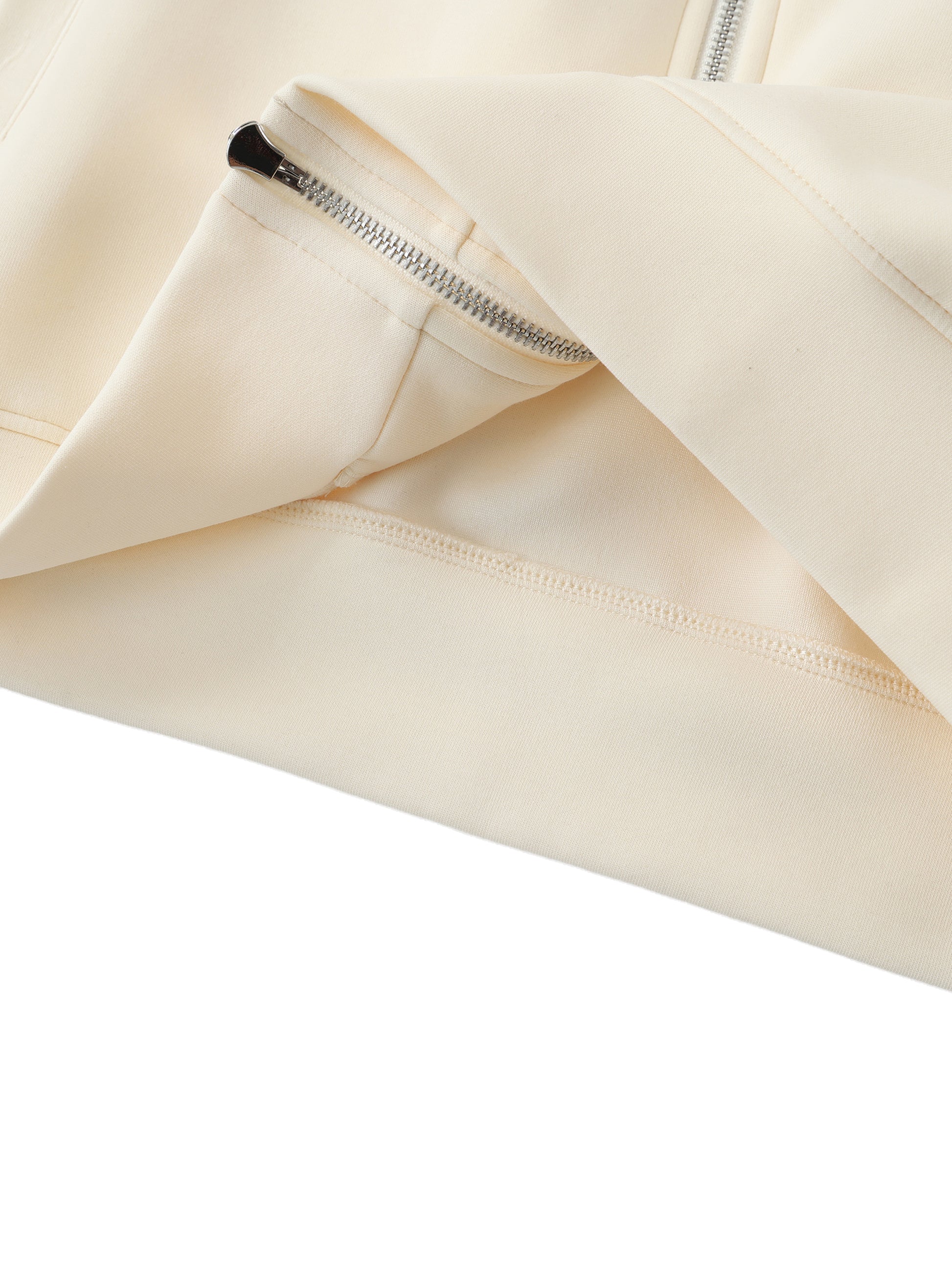 Cream raglan zip hoodie close-up of silver zipper and pocket area