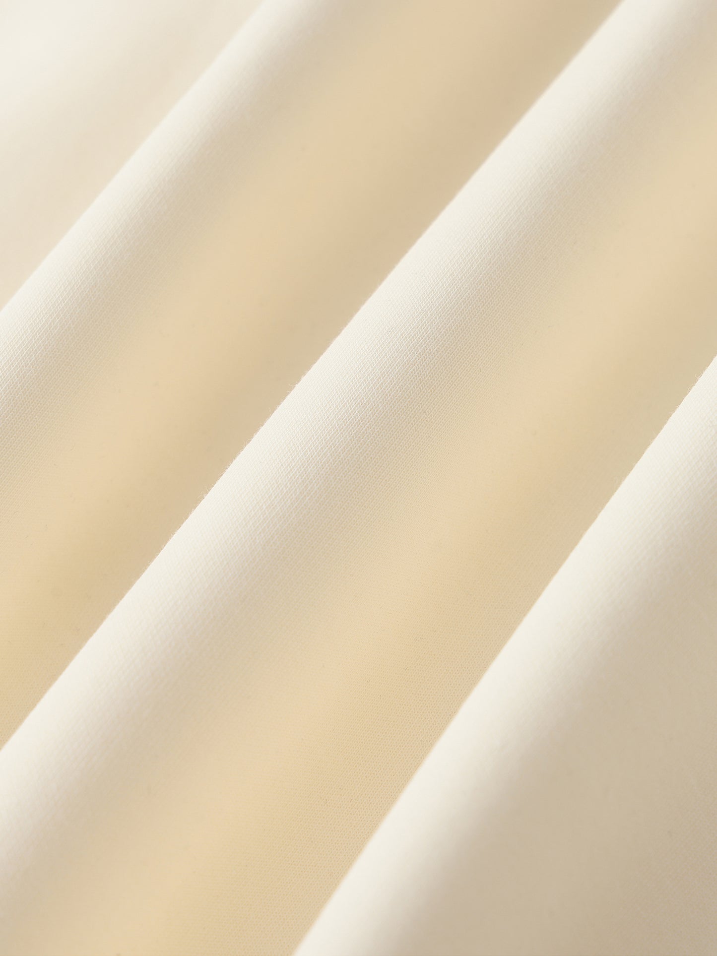 Cream raglan zip hoodie fabric close-up with seam lines
