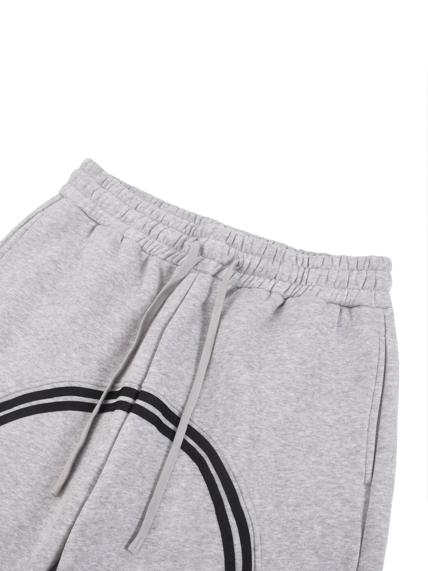 Heather gray joggers close-up: elastic waistband and drawstring with black side stripe