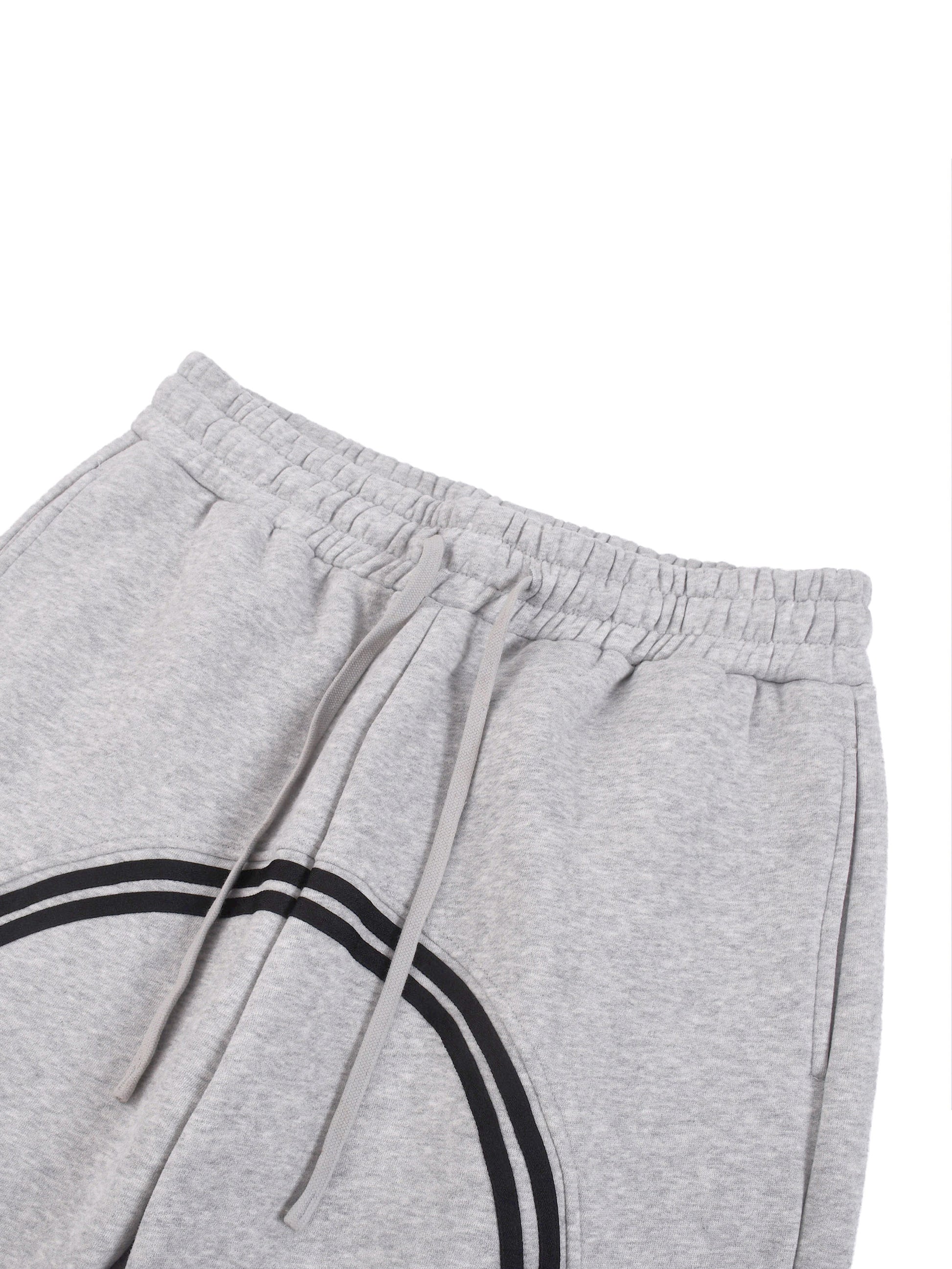 Heather gray joggers close-up: elastic waistband and drawstring with black side stripe