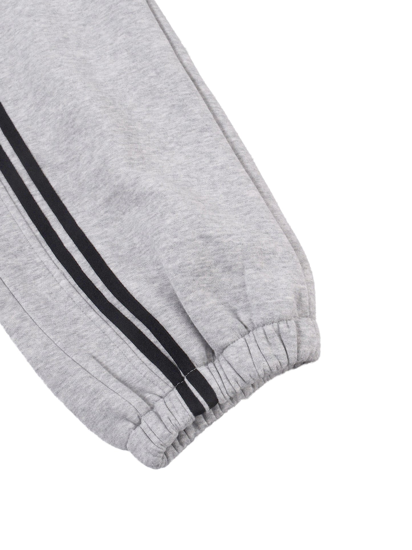 Heather gray joggers close-up: elastic cuff with black double side stripes