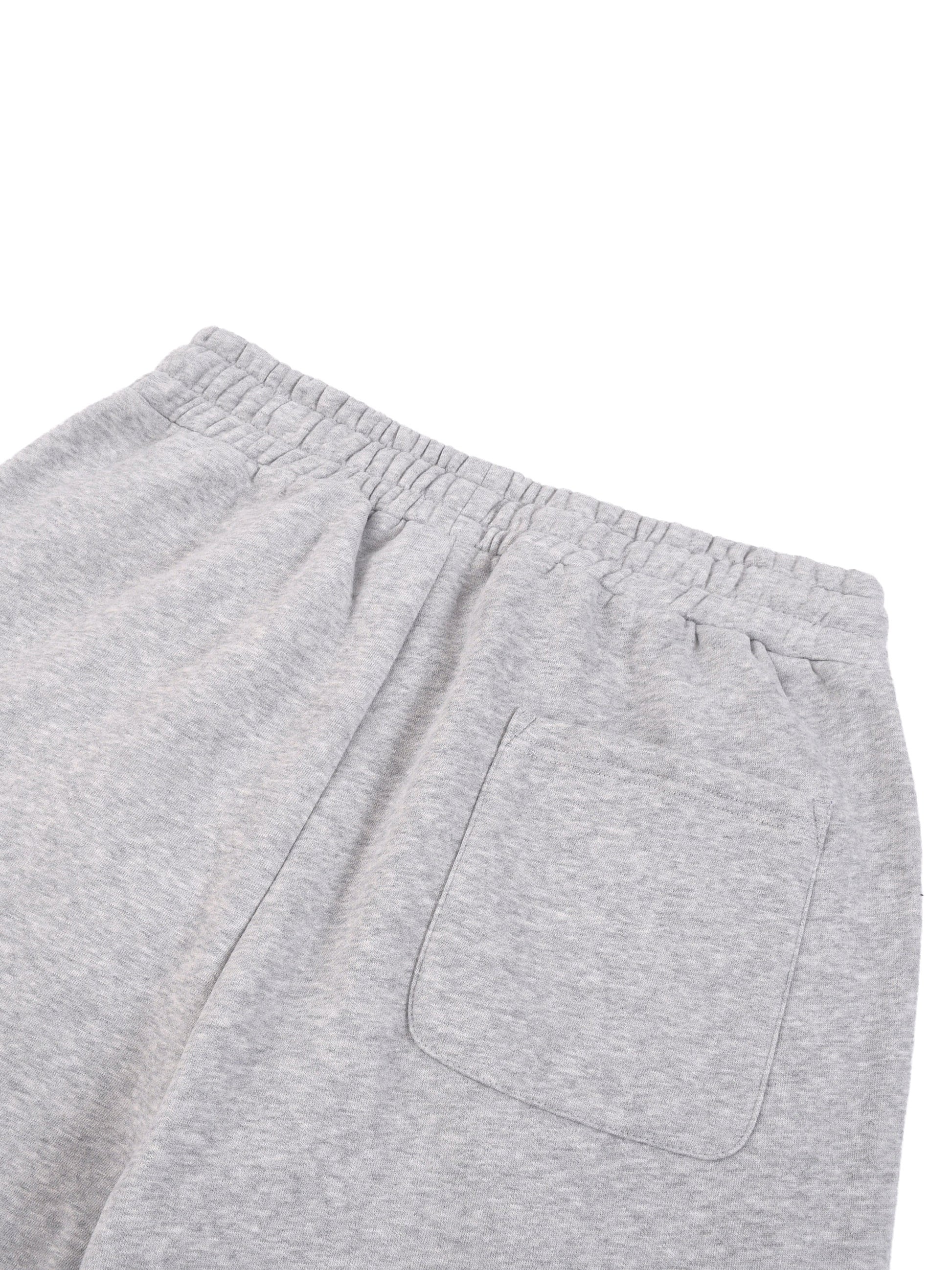 Heather gray joggers close-up: back patch pocket and relaxed leg drape