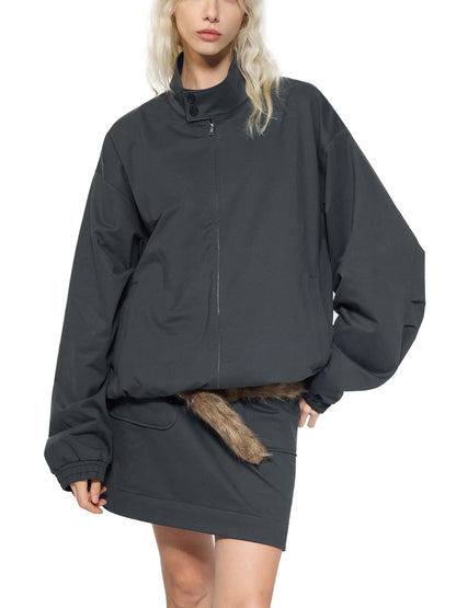 Dark bomber jacket with stand collar, zip front, faux fur trimmed hem