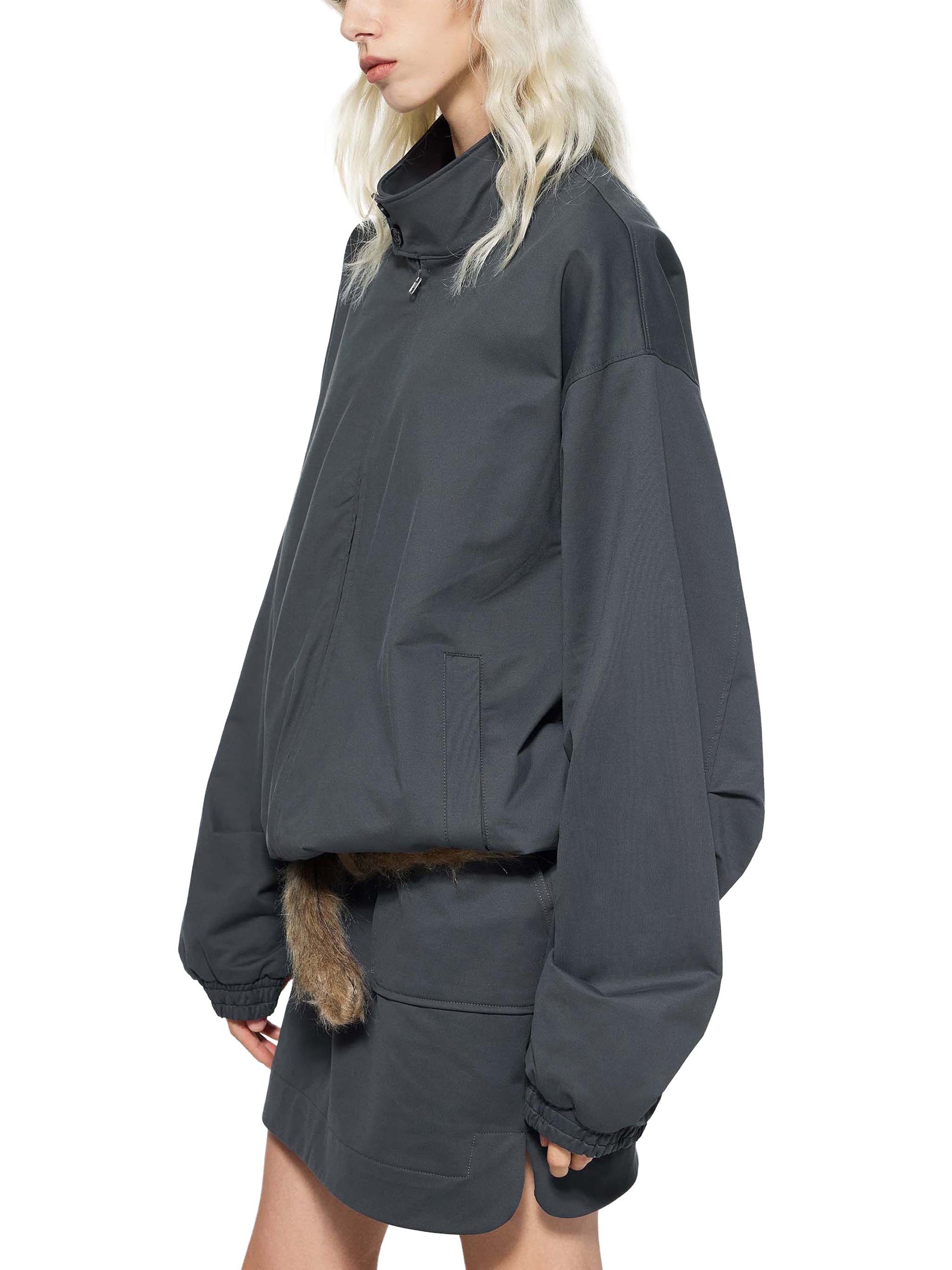 Dark bomber jacket with stand collar, zip front, chest pocket, ribbed hem
