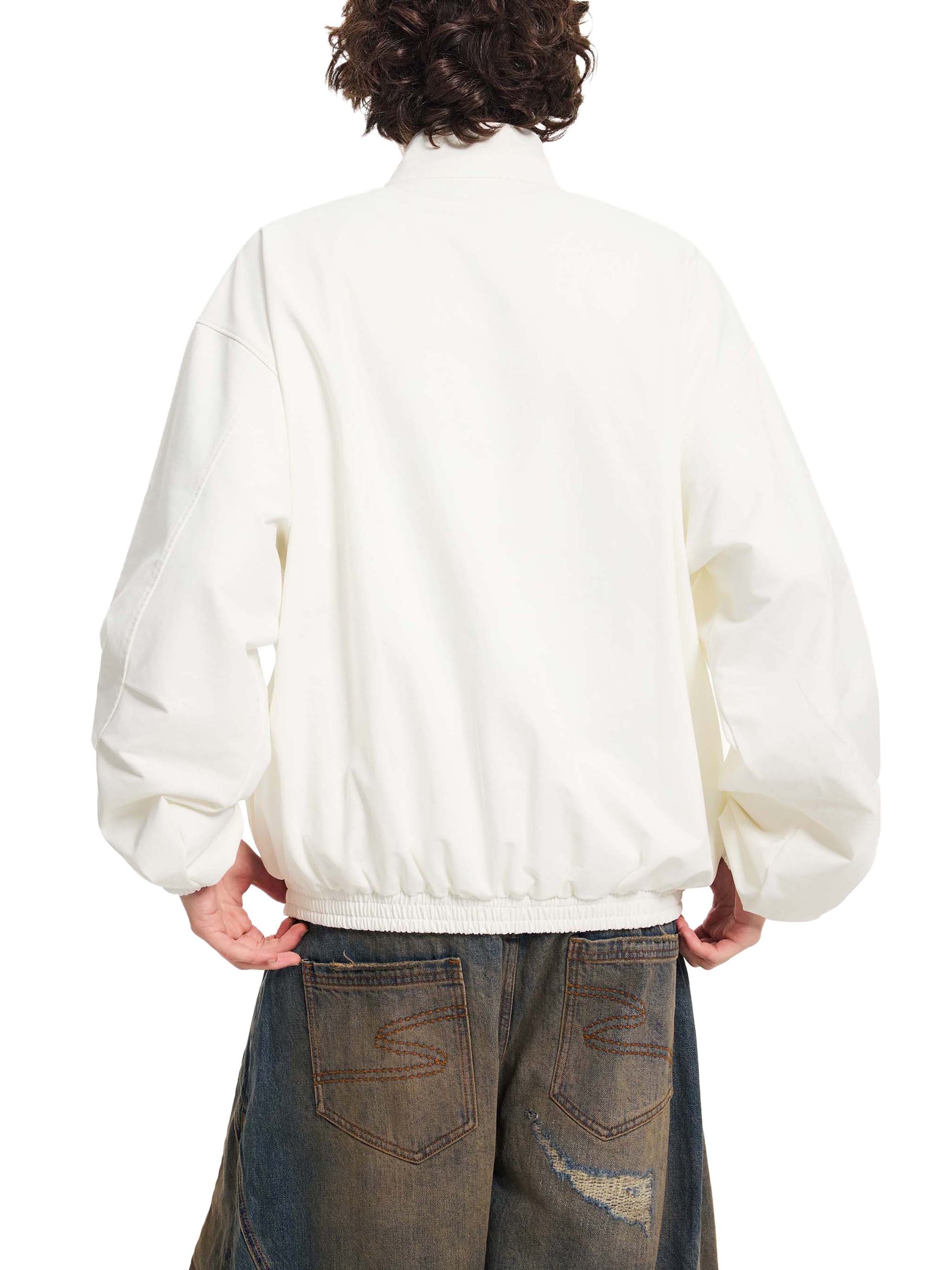 Cream stand collar bomber jacket, ribbed waistband and cuffs, zip front (back)