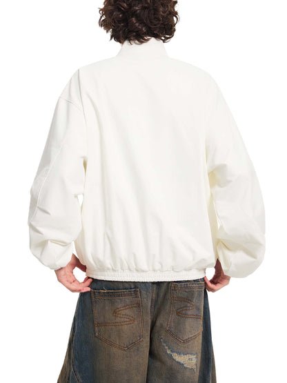 Cream stand collar bomber jacket, ribbed waistband and cuffs, zip front (back)