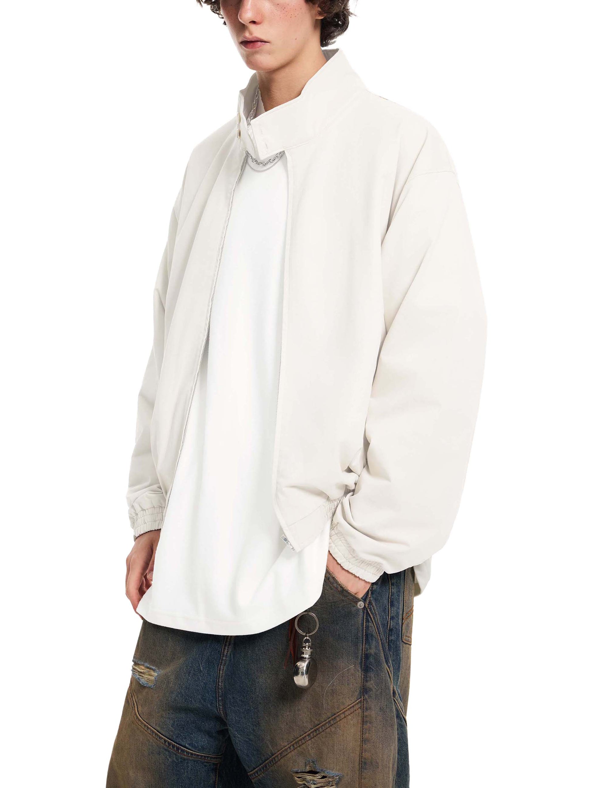 Cream stand collar bomber jacket, zip front and ribbed cuffs, side view