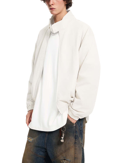 Cream stand collar bomber jacket, zip front and ribbed cuffs, side view