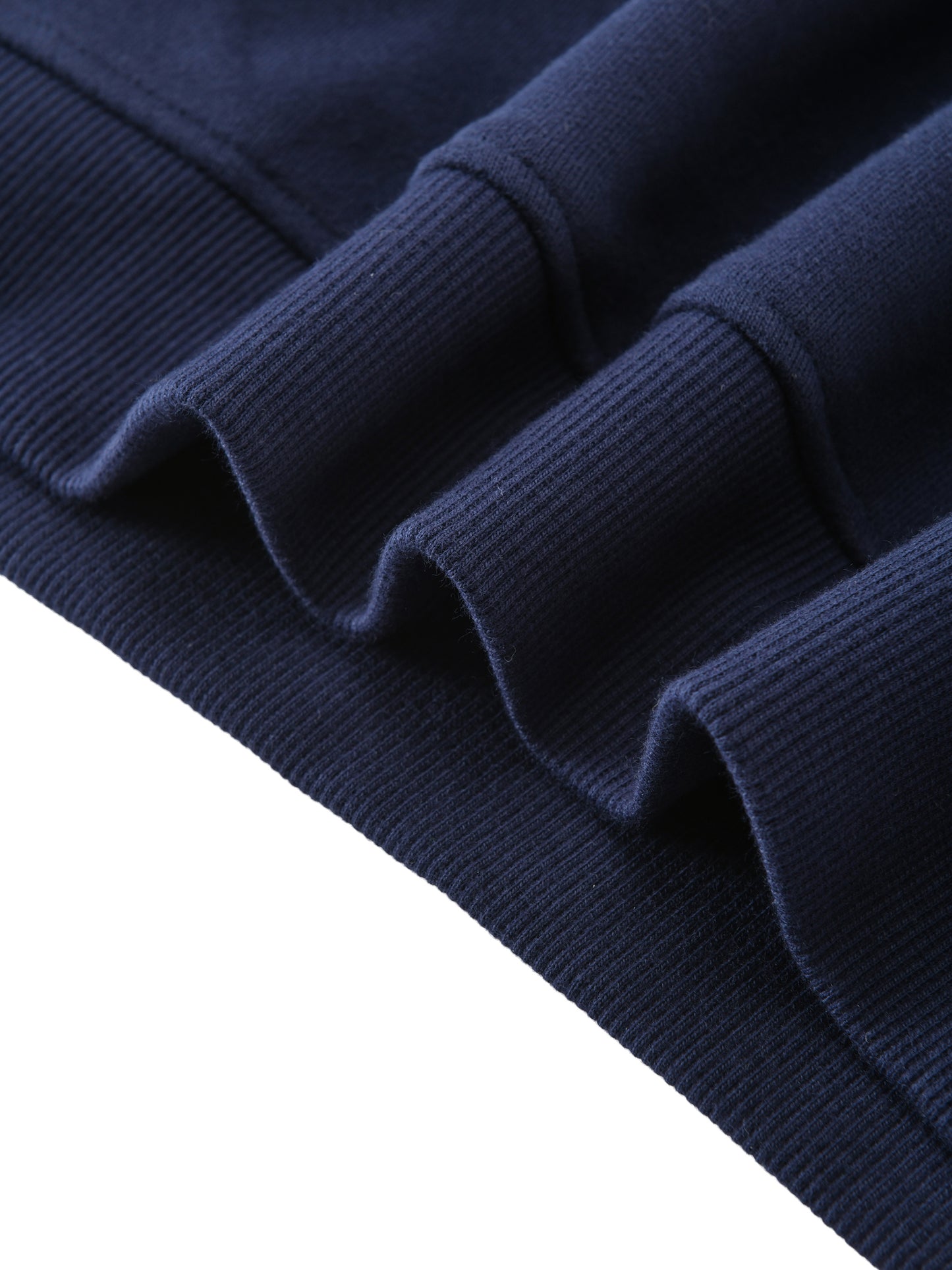 Kids fleece crewneck, navy, ribbed cuffs texture close-up