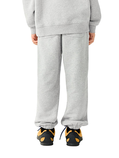 Kids fleece jogger in light gray worn, relaxed leg fit with elastic cuffs and waistband