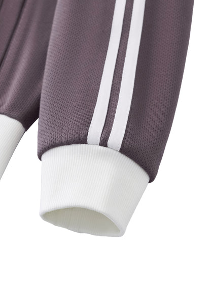Purple cropped track jacket sleeve cuff with white rib knit and contrast stripe trim