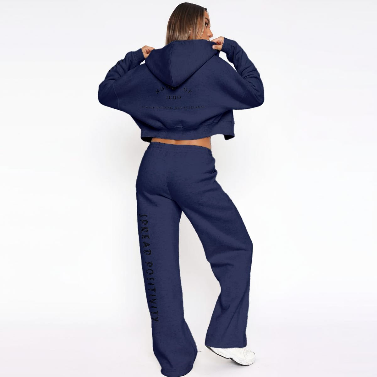 Women’s fleece tracksuit: navy cropped hoodie and wide-leg pants with logo print.