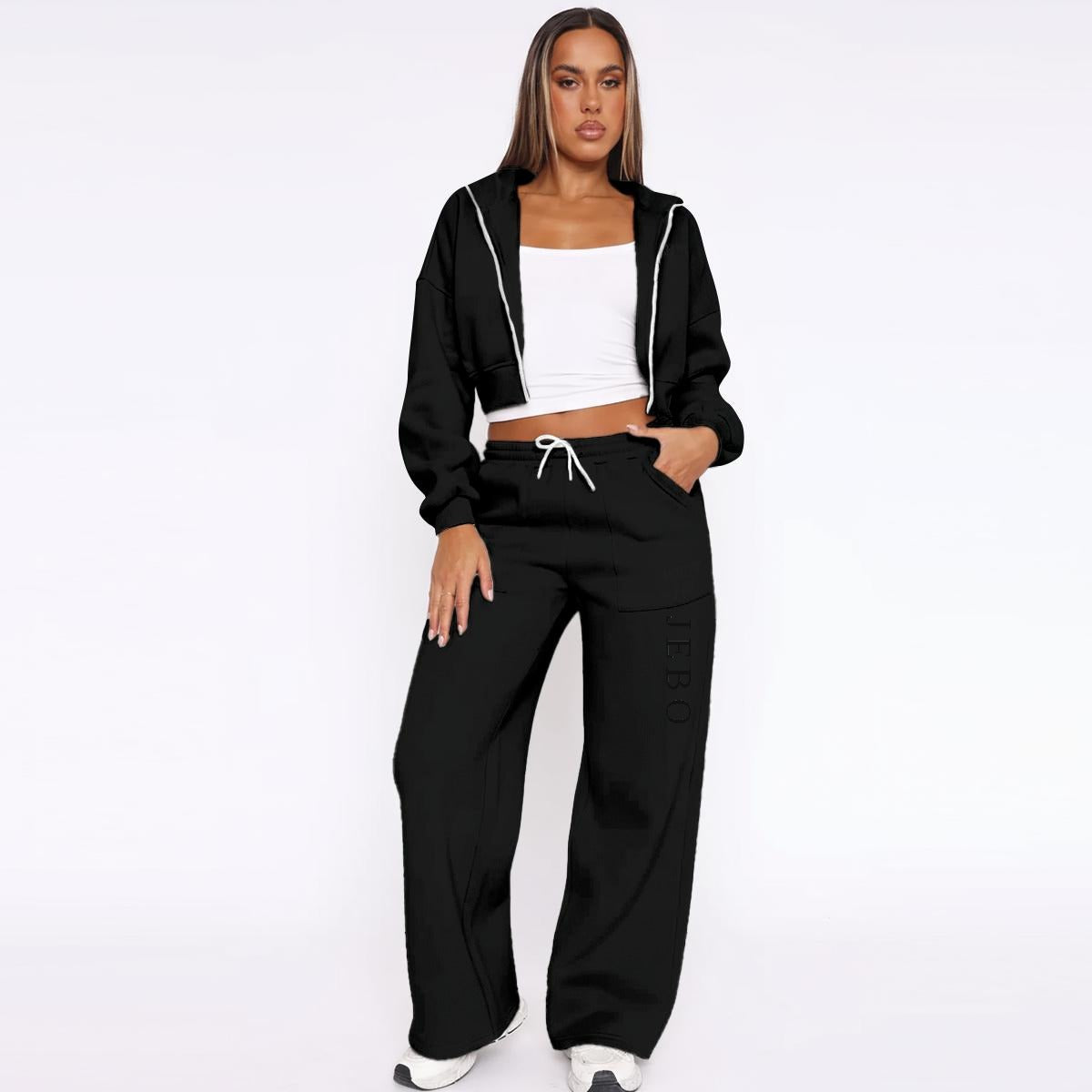 Women’s black fleece tracksuit set with zip hoodie and drawstring wide-leg sweatpants.