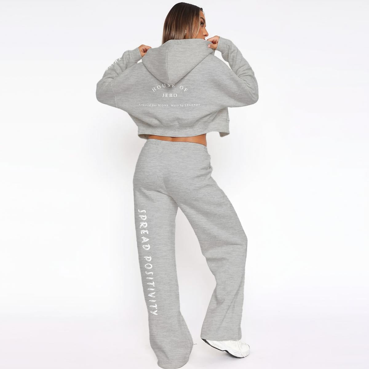 Gray fleece tracksuit: hooded zip hoodie and drawstring wide-leg joggers with vertical side text.