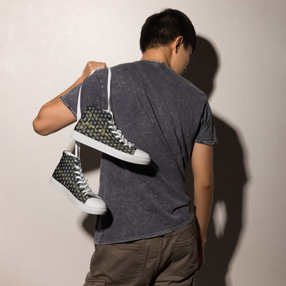 Person wearing black high-top canvas sneakers with gold-and-white monogram pattern and white soles