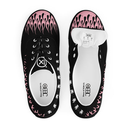 Black canvas sneaker pair top view with pink flame pattern and white tongue labels
