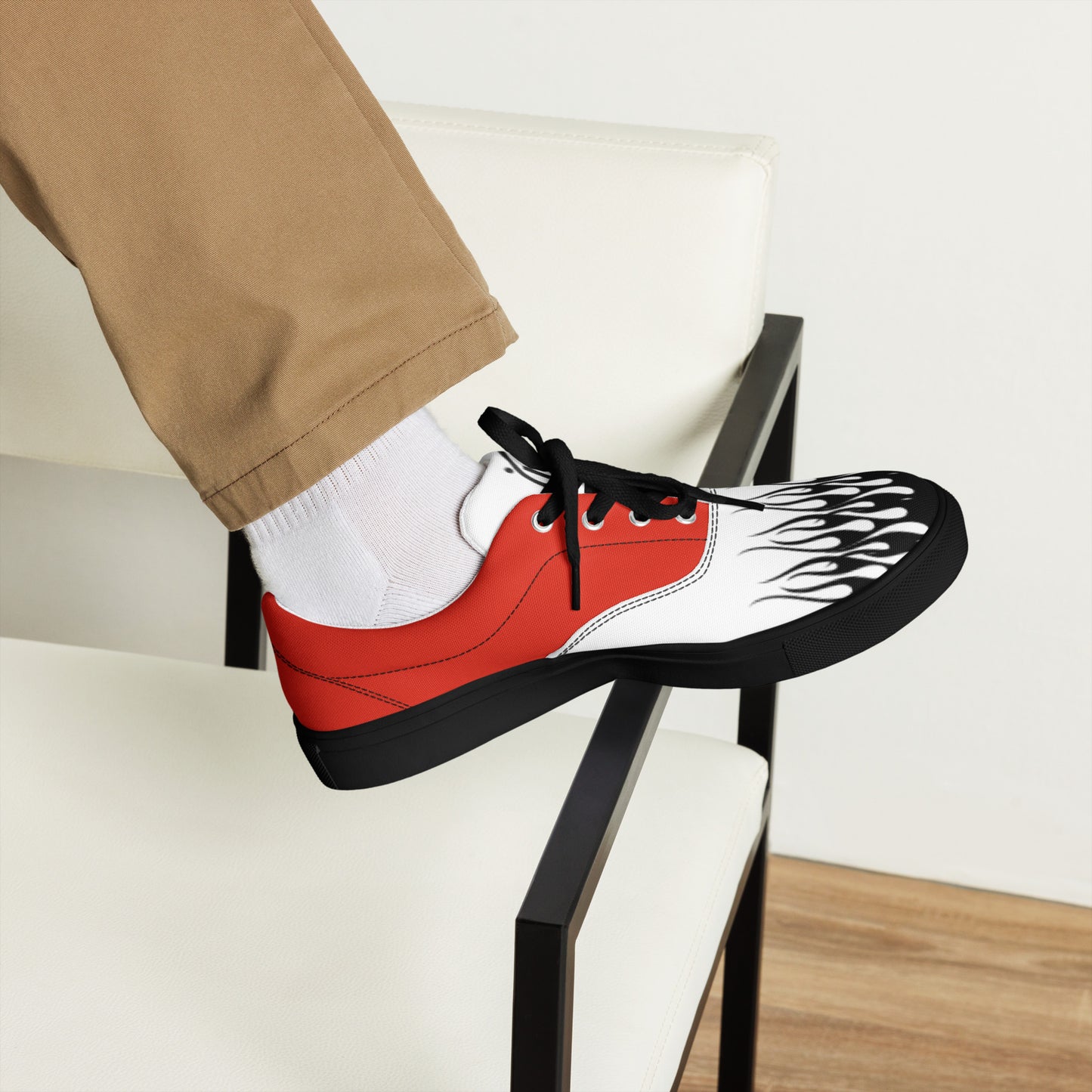 Canvas sneaker red and white with black flame print and black laces, side view