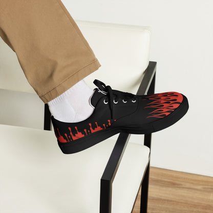 Black canvas sneaker with red flame side pattern and white laces, classic lace-up.