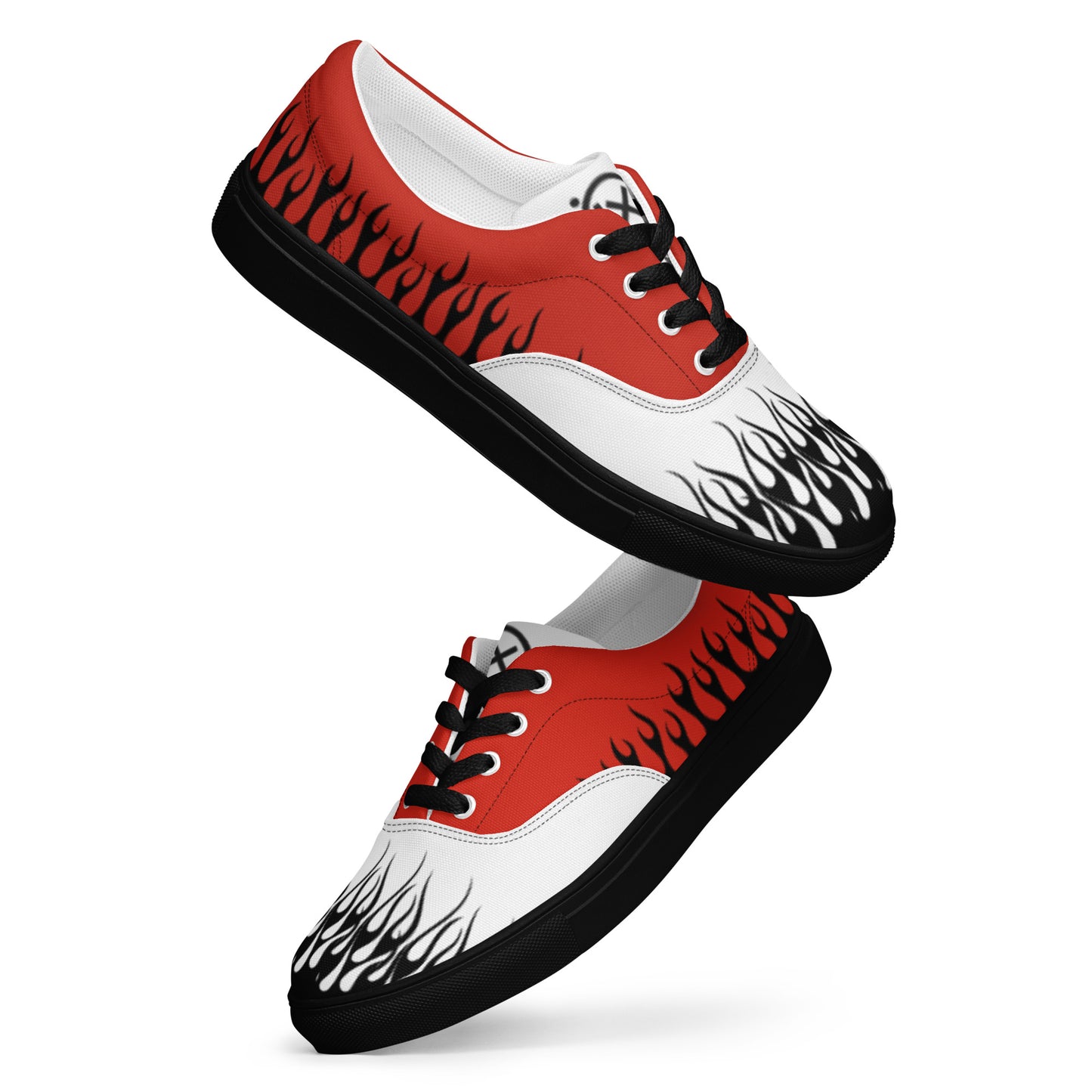 Red, white, and black canvas sneaker with flame-style graphics and black rubber sole