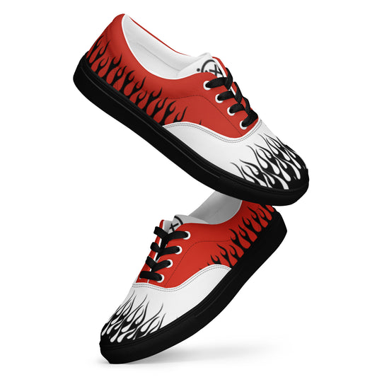 Red, white, and black canvas sneaker with flame-style graphics and black rubber sole