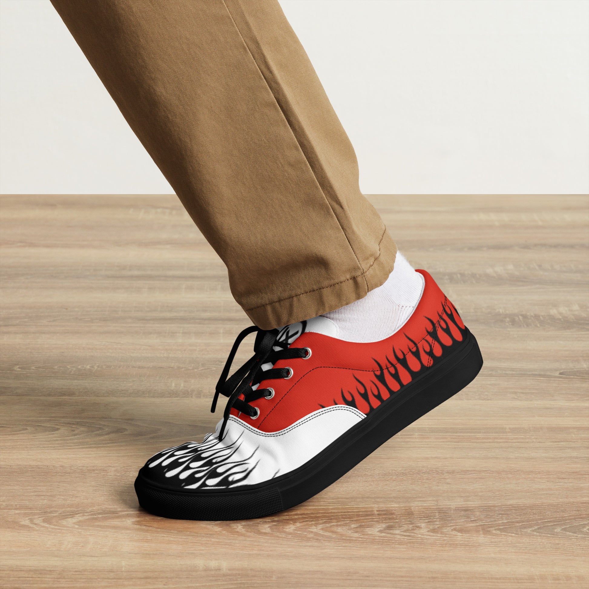 Canvas sneaker red upper with white toe panel, black flame print, black rubber sole