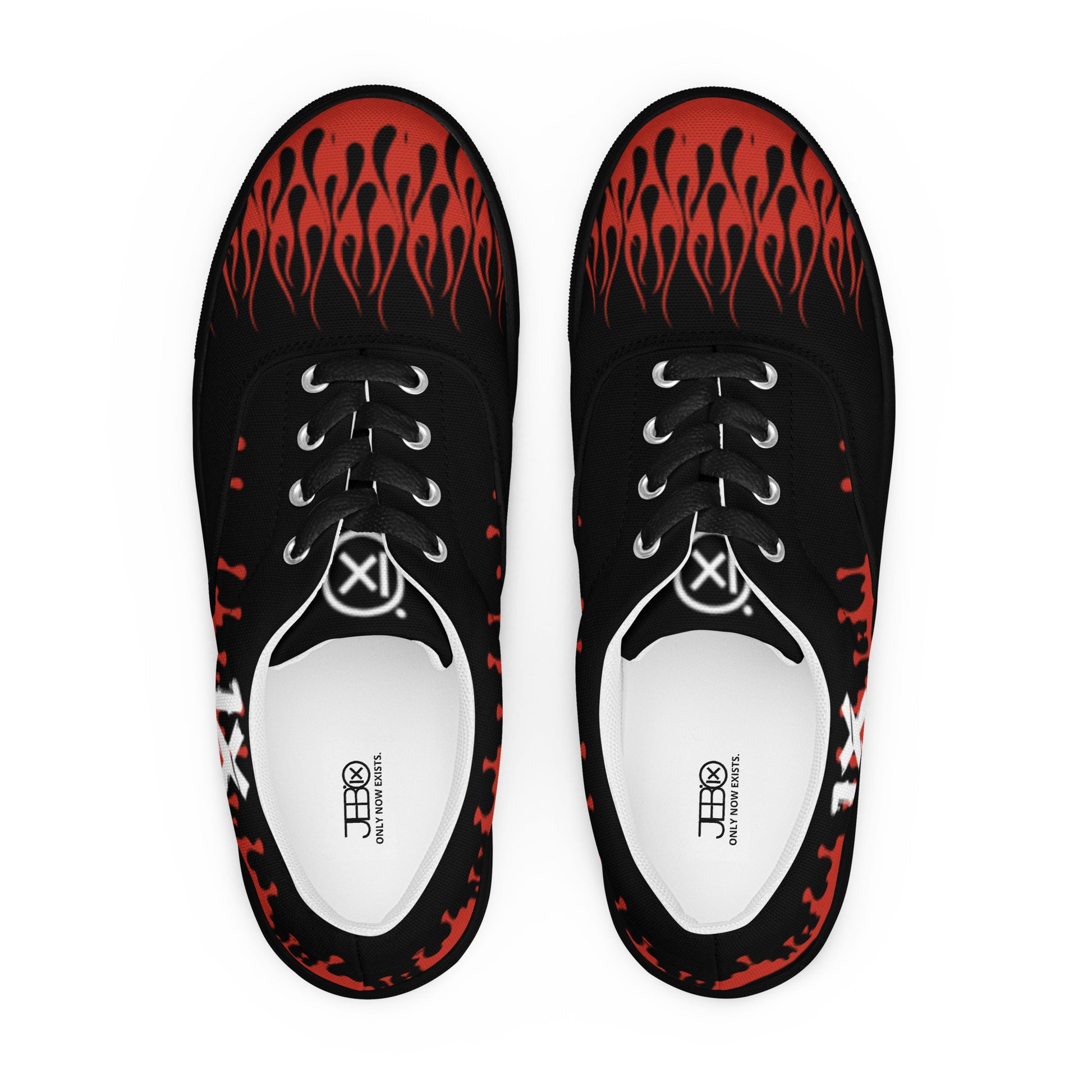 Black canvas sneakers with red flame pattern and white laces, front view pair.