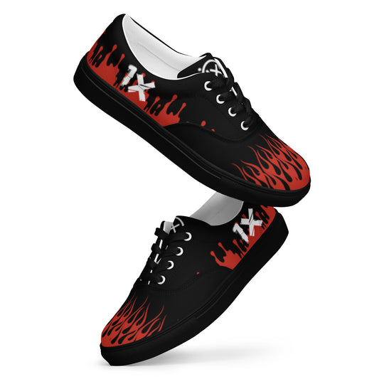 Canvas sneaker side view, black upper with red flame print, white midsole and black outsole