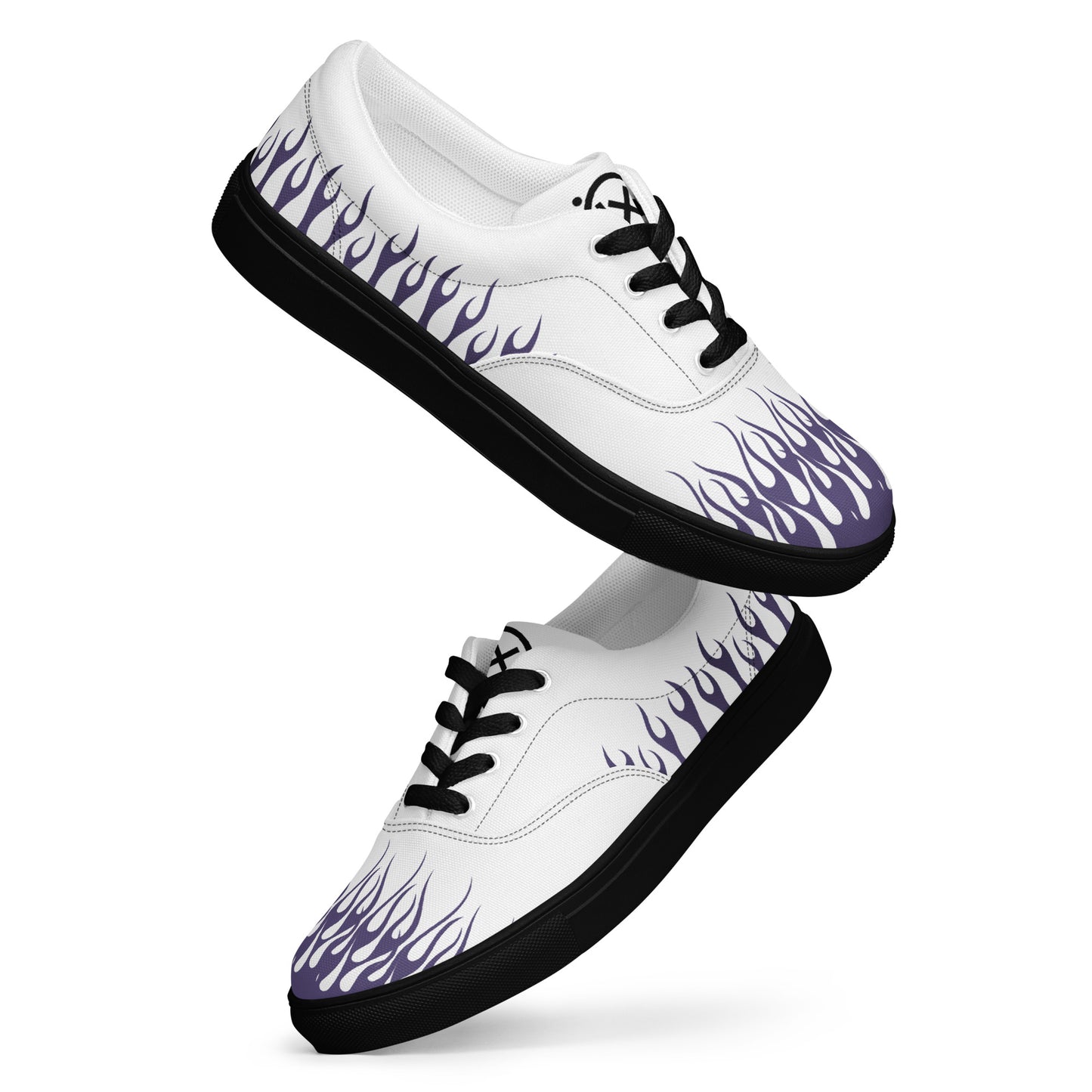 White canvas low-top sneakers with purple flame print, black laces and sole.