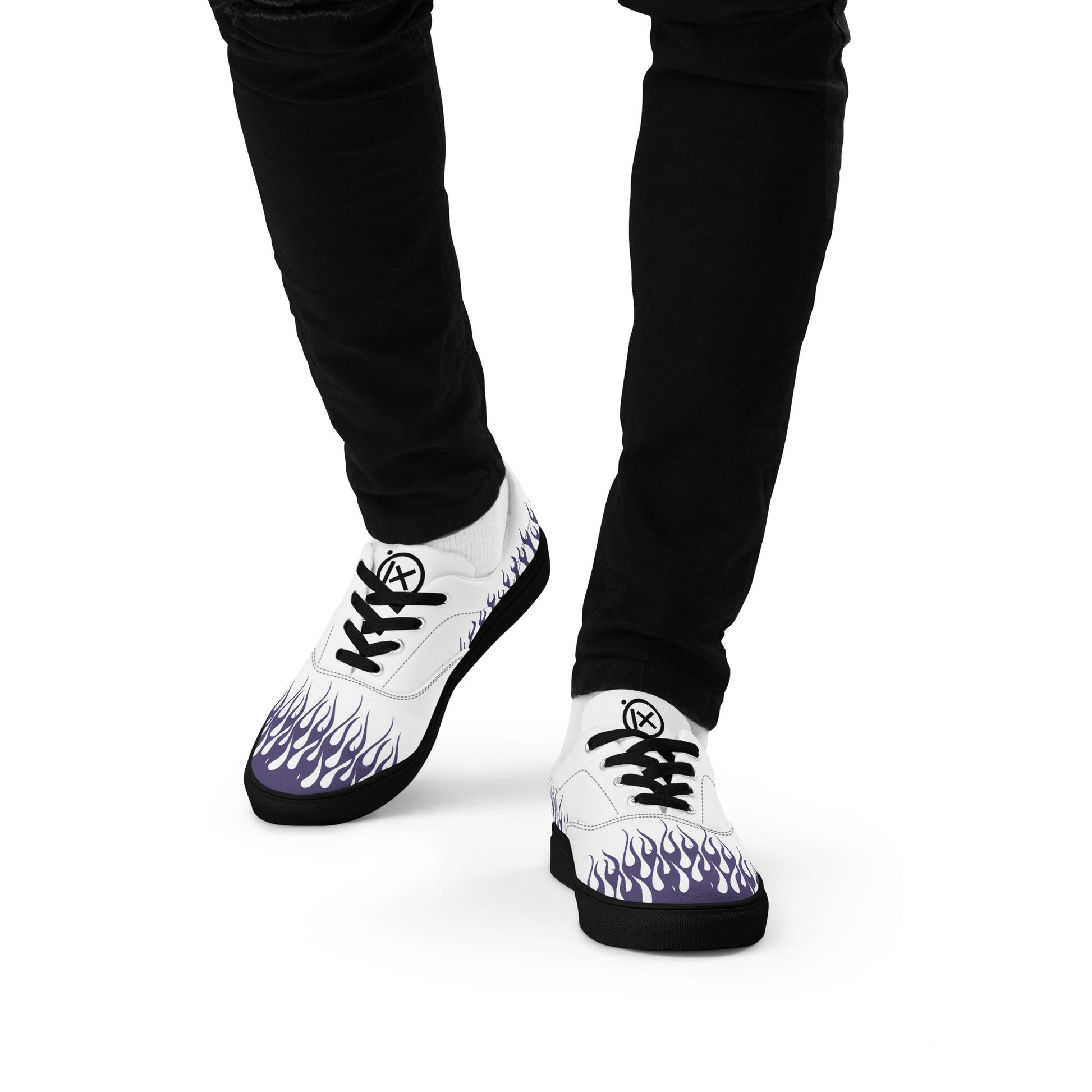 White canvas sneaker with violet flame print on sides and heel; black sole
