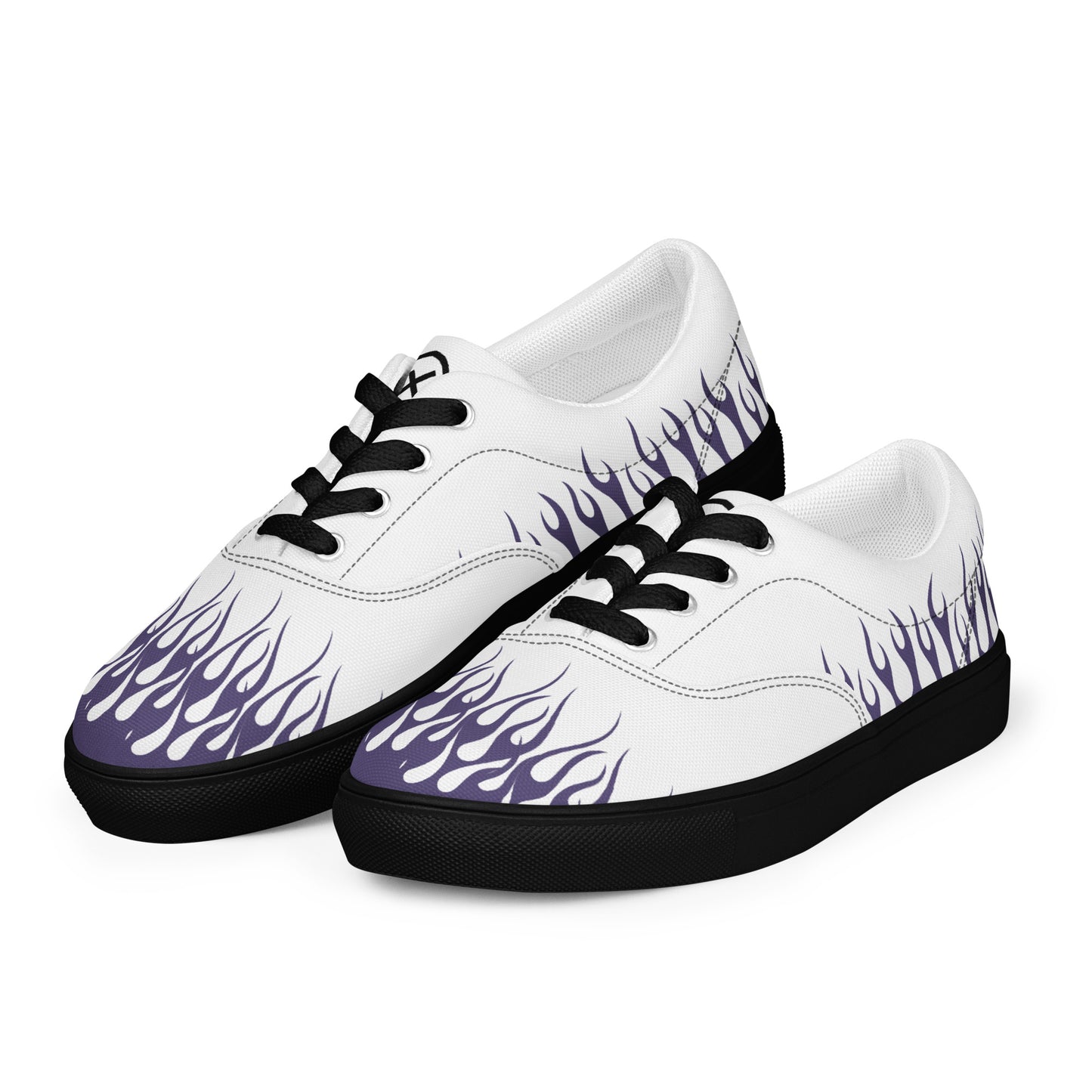 White canvas sneakers with violet flame print, black laces, and black rubber sole, angled view.
