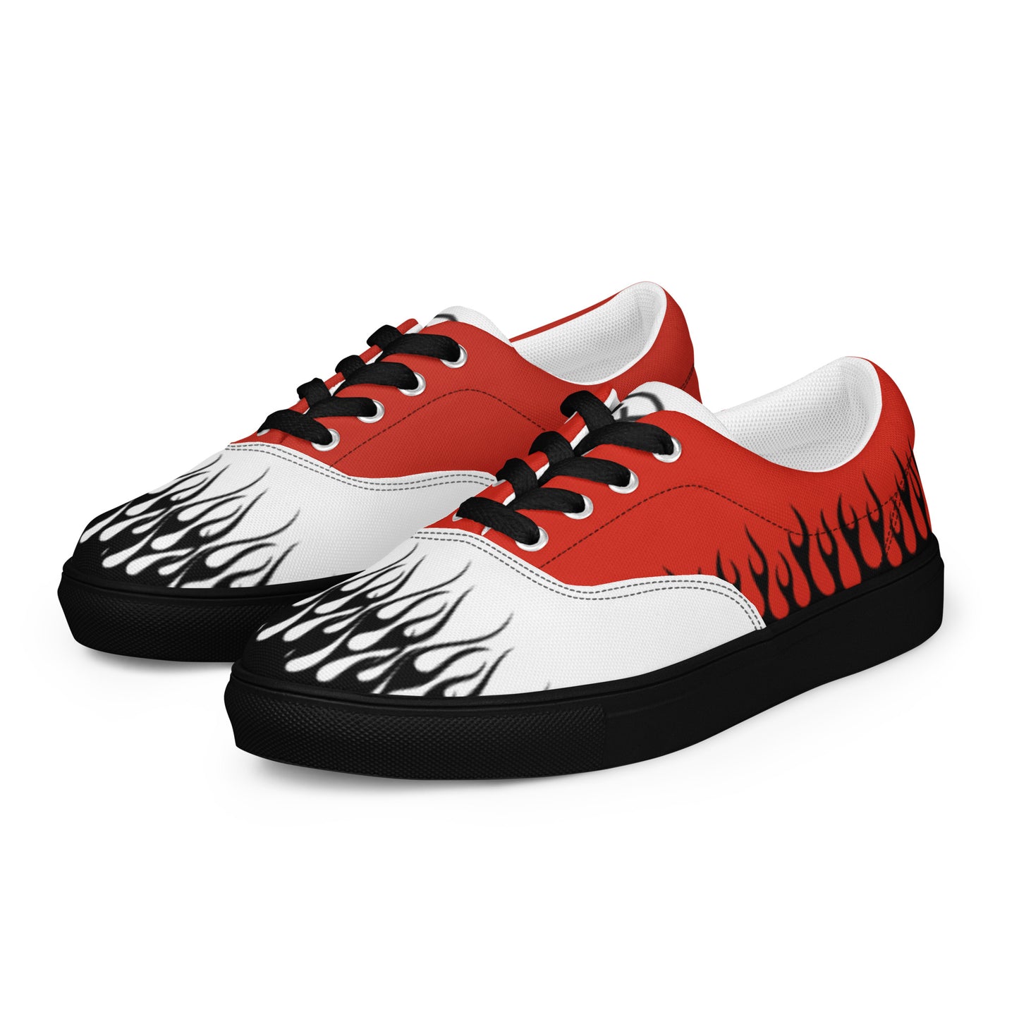 Red and white low-top canvas sneakers with black laces, flame graphics, and black rubber sole