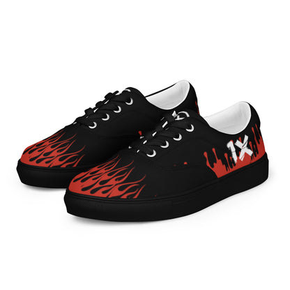 Canvas sneakers pair, black uppers with red flame pattern, white lining and eyelets