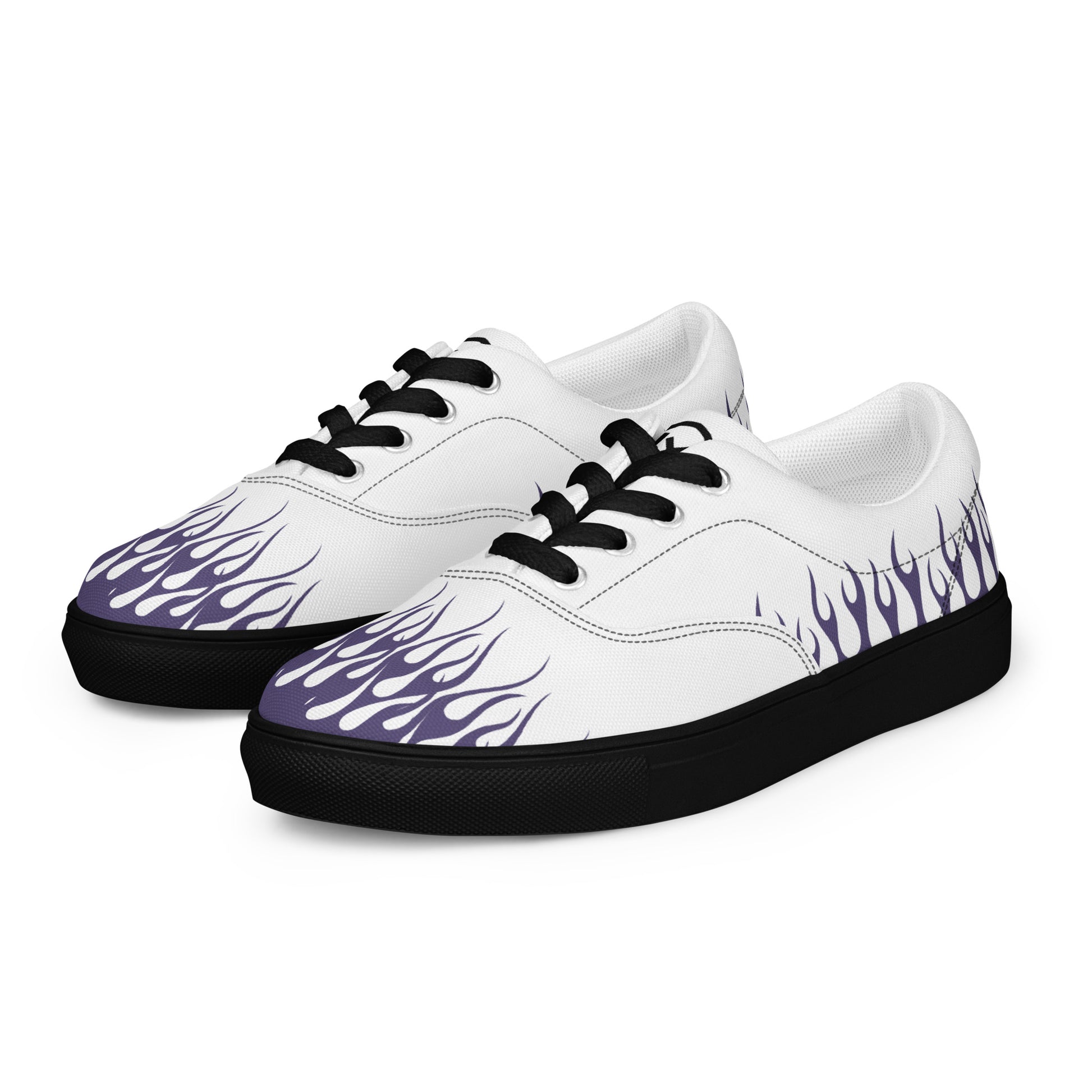 White canvas low-top sneakers with purple flame print, black trim and sole.