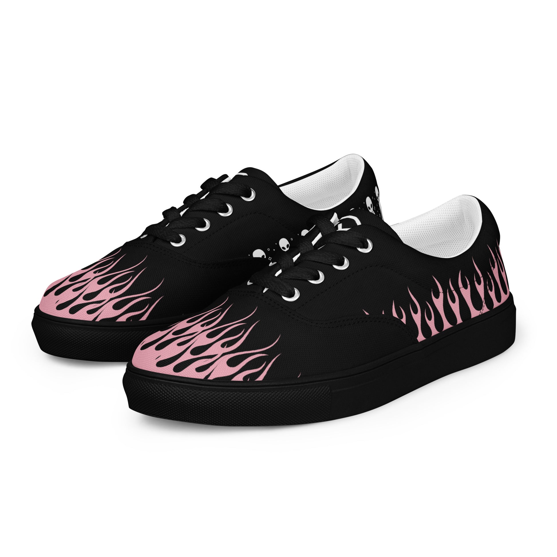 Black canvas sneaker side view with pink flame print and thick dark rubber sole