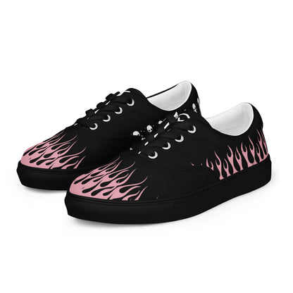Black canvas sneaker side view with pink flame print and thick dark rubber sole