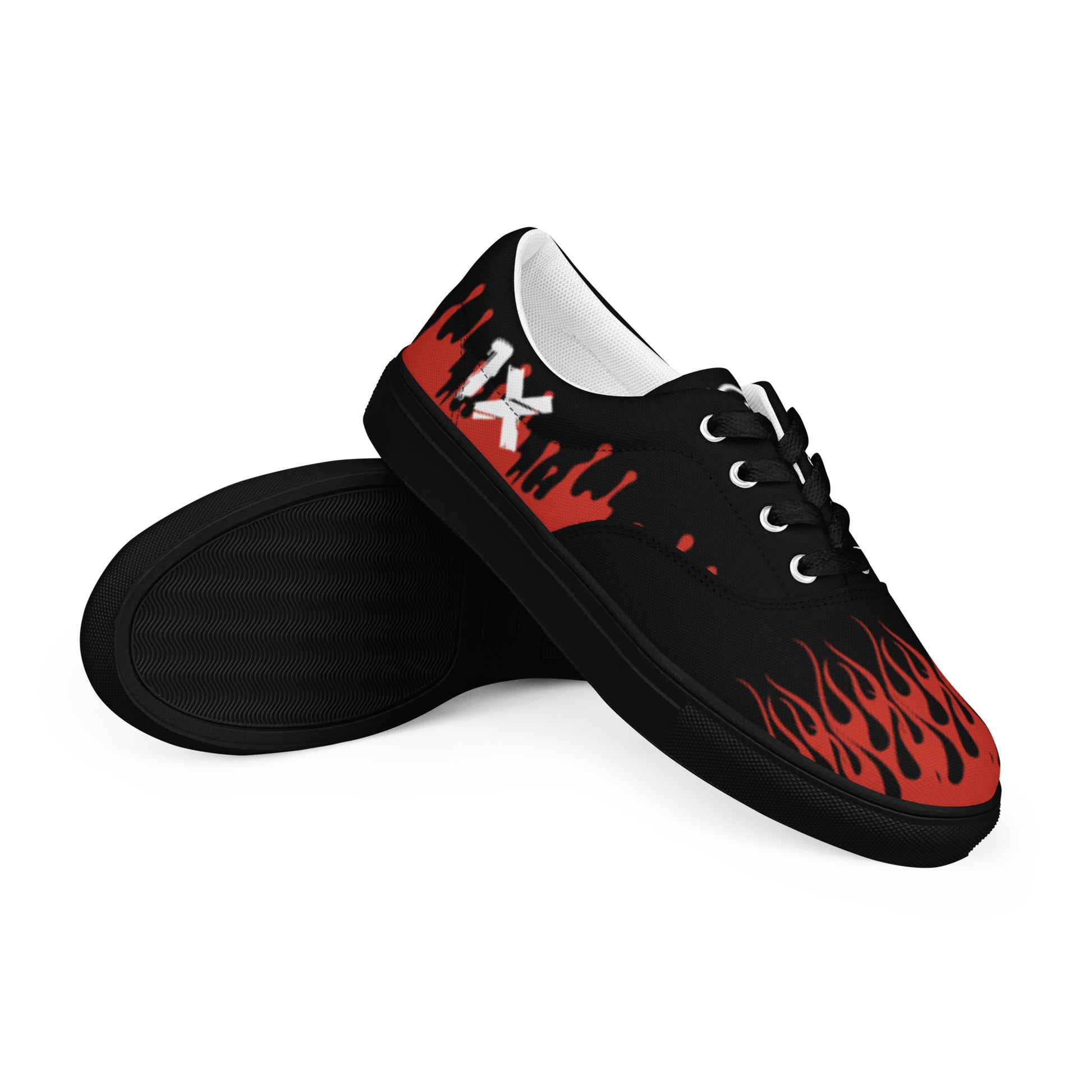 Black low-top sneaker with red flame print and dark sole, lace-up.