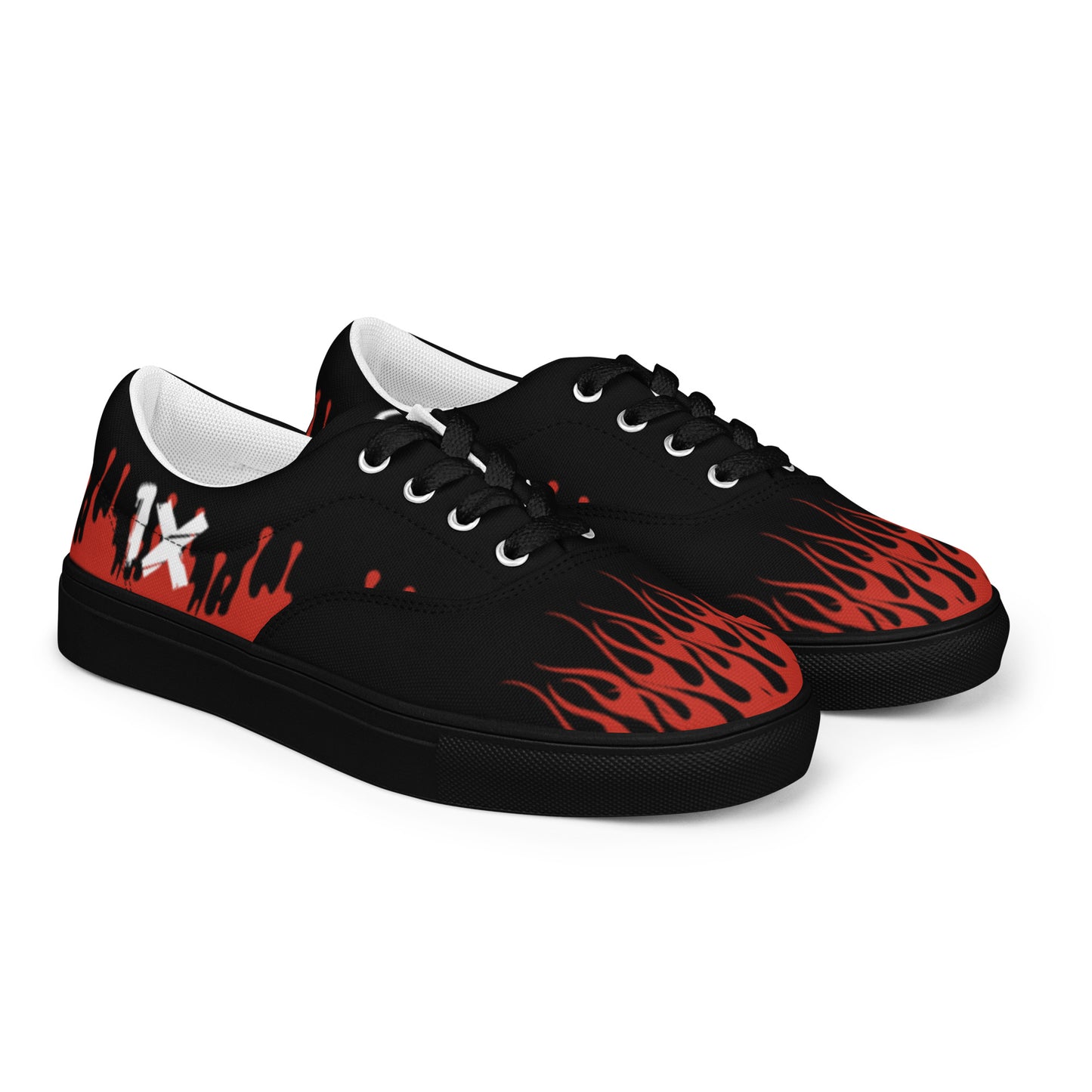 Canvas sneakers angled side view, black upper with red flame graphic and white sole