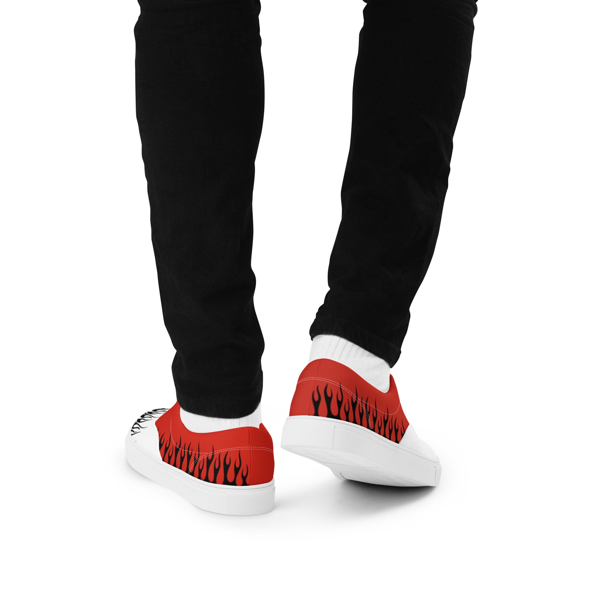 Rear view of red and white flame sneakers with white heel and black pants
