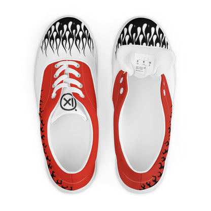 Pair of low-top canvas sneakers with red uppers, flame graphics, white laces, and heel label