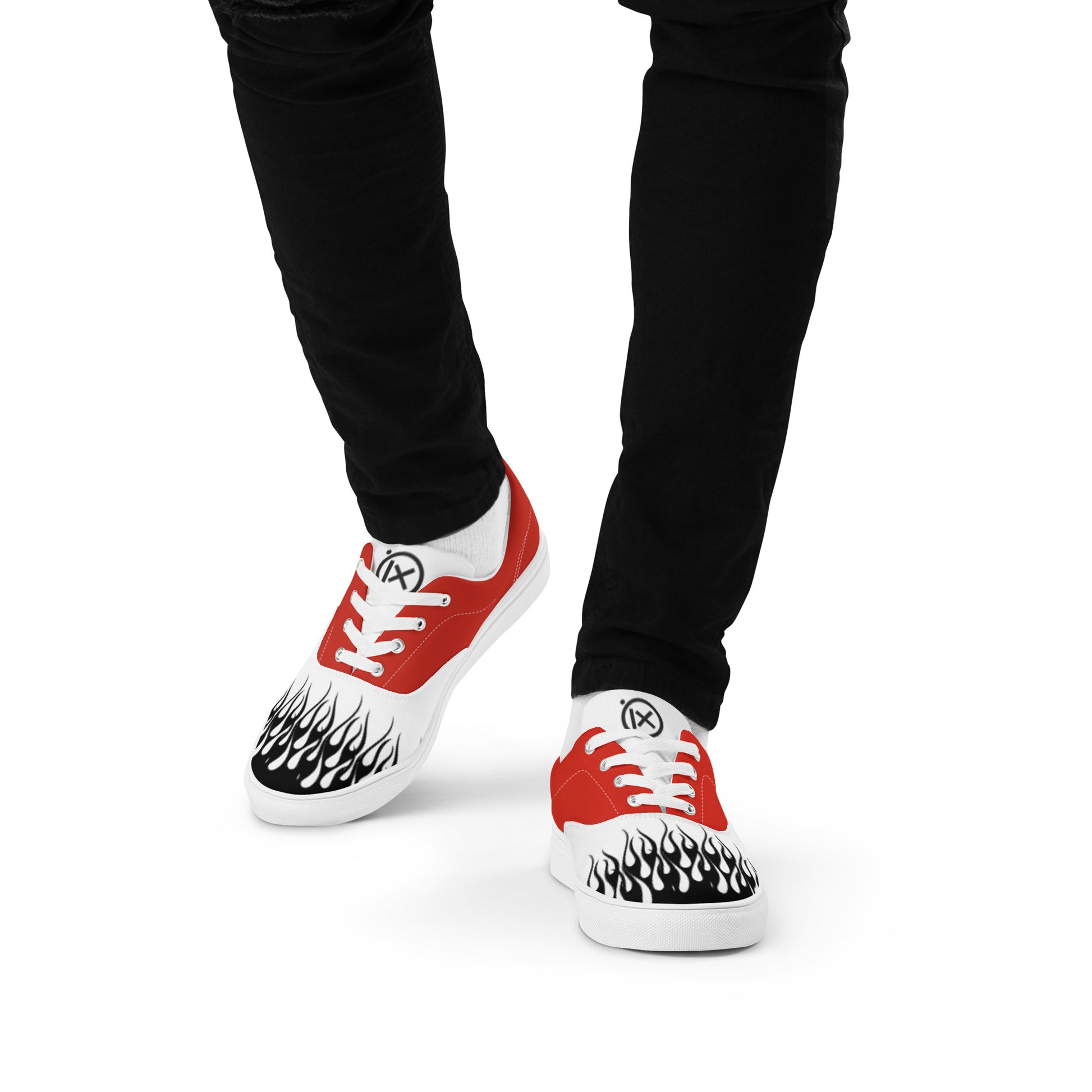 Flame-print red and white sneakers with black pants, front sides visible
